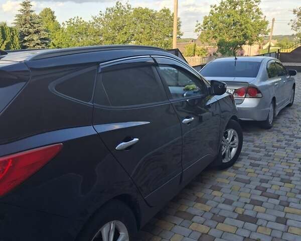 Черный Хендай их35, объемом двигателя 2 л и пробегом 280 тыс. км за 12550 $, фото 7 на Automoto.ua