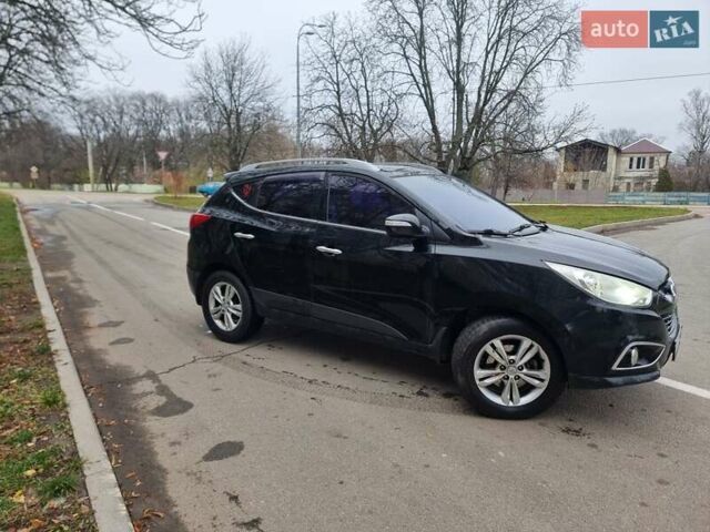 Чорний Хендай іх35, об'ємом двигуна 2 л та пробігом 188 тис. км за 11200 $, фото 6 на Automoto.ua