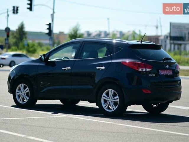 Чорний Хендай іх35, об'ємом двигуна 2 л та пробігом 226 тис. км за 10990 $, фото 6 на Automoto.ua