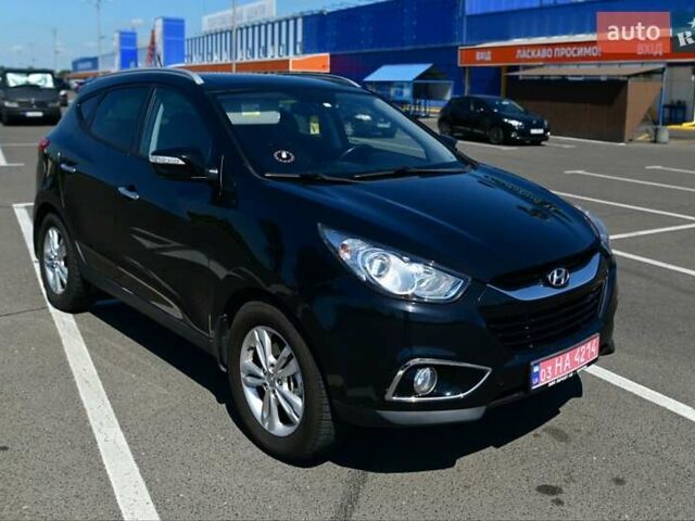 Чорний Хендай іх35, об'ємом двигуна 2 л та пробігом 226 тис. км за 10990 $, фото 7 на Automoto.ua