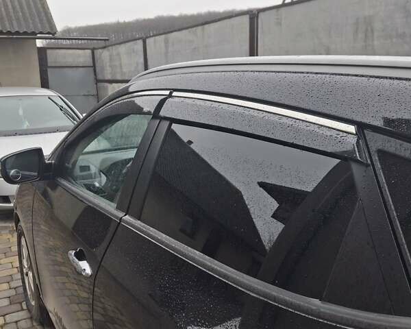 Чорний Хендай іх35, об'ємом двигуна 2 л та пробігом 255 тис. км за 12750 $, фото 1 на Automoto.ua