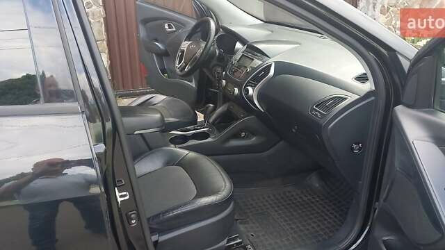 Чорний Хендай іх35, об'ємом двигуна 2 л та пробігом 200 тис. км за 14500 $, фото 2 на Automoto.ua