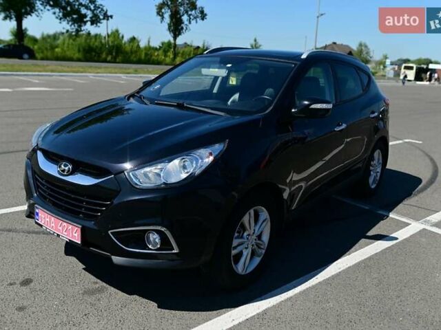 Чорний Хендай іх35, об'ємом двигуна 2 л та пробігом 226 тис. км за 10990 $, фото 9 на Automoto.ua