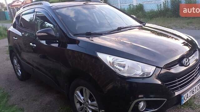 Чорний Хендай іх35, об'ємом двигуна 2 л та пробігом 200 тис. км за 14500 $, фото 1 на Automoto.ua