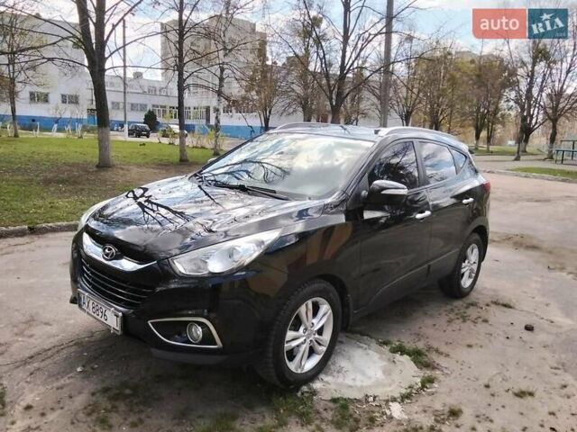 Чорний Хендай іх35, об'ємом двигуна 2 л та пробігом 180 тис. км за 12999 $, фото 21 на Automoto.ua