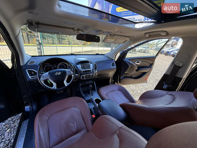 Чорний Хендай іх35, об'ємом двигуна 2 л та пробігом 153 тис. км за 13999 $, фото 23 на Automoto.ua
