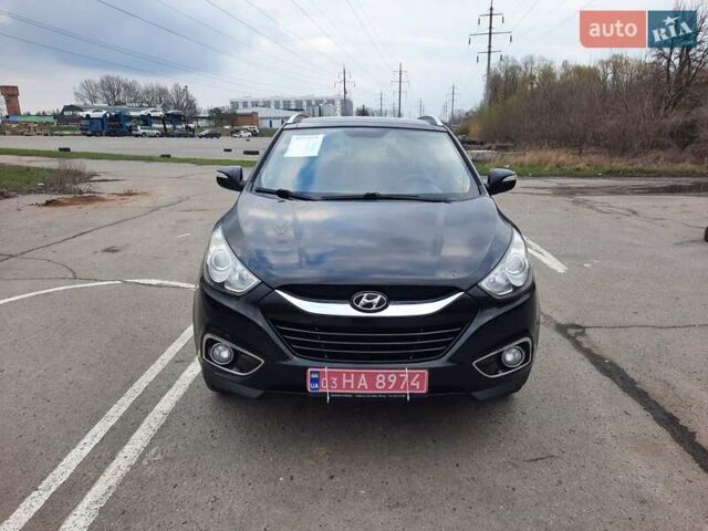 Чорний Хендай іх35, об'ємом двигуна 2 л та пробігом 211 тис. км за 12700 $, фото 5 на Automoto.ua