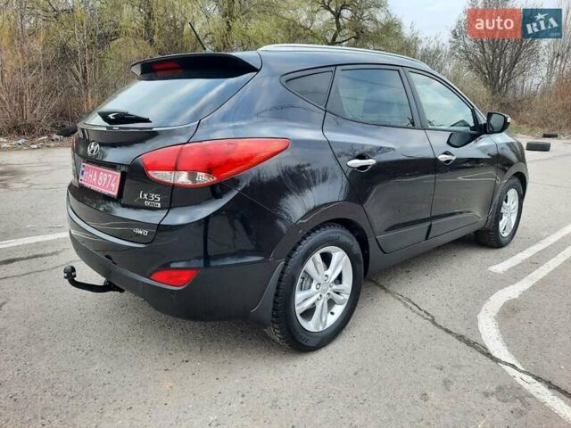 Чорний Хендай іх35, об'ємом двигуна 2 л та пробігом 211 тис. км за 12700 $, фото 16 на Automoto.ua