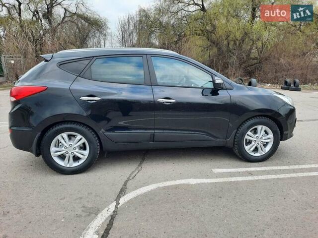 Чорний Хендай іх35, об'ємом двигуна 2 л та пробігом 211 тис. км за 12700 $, фото 19 на Automoto.ua