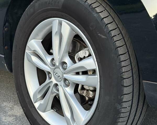 Чорний Хендай іх35, об'ємом двигуна 2 л та пробігом 173 тис. км за 13800 $, фото 24 на Automoto.ua