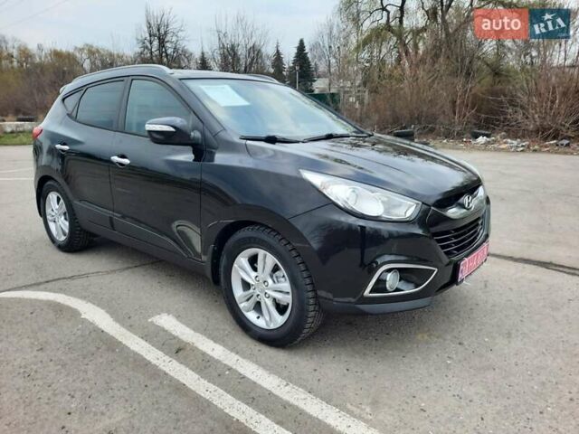 Чорний Хендай іх35, об'ємом двигуна 2 л та пробігом 211 тис. км за 12700 $, фото 20 на Automoto.ua