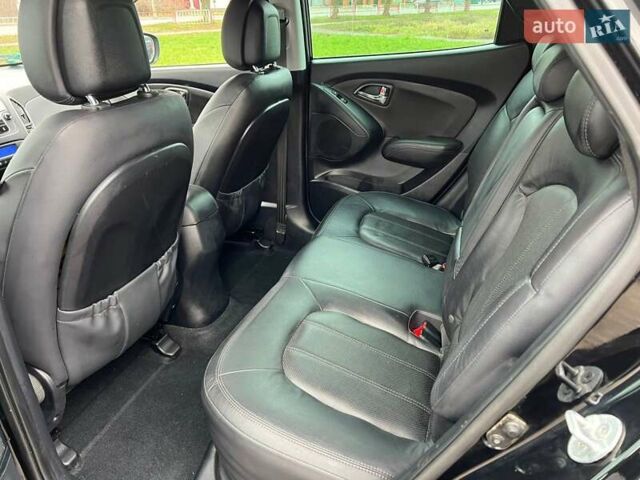 Чорний Хендай іх35, об'ємом двигуна 2 л та пробігом 195 тис. км за 12800 $, фото 14 на Automoto.ua