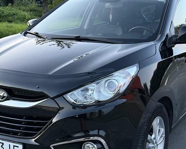 Чорний Хендай іх35, об'ємом двигуна 2 л та пробігом 173 тис. км за 13800 $, фото 8 на Automoto.ua