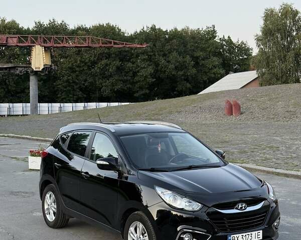 Чорний Хендай іх35, об'ємом двигуна 2 л та пробігом 173 тис. км за 13800 $, фото 7 на Automoto.ua