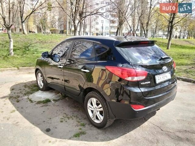 Чорний Хендай іх35, об'ємом двигуна 2 л та пробігом 180 тис. км за 12999 $, фото 5 на Automoto.ua
