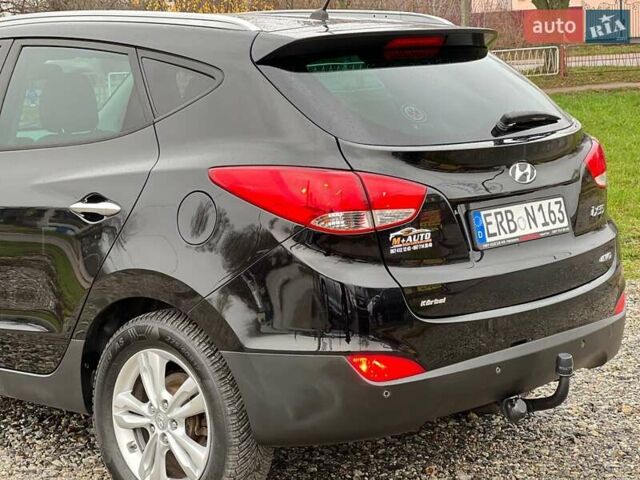 Чорний Хендай іх35, об'ємом двигуна 2 л та пробігом 195 тис. км за 12800 $, фото 20 на Automoto.ua