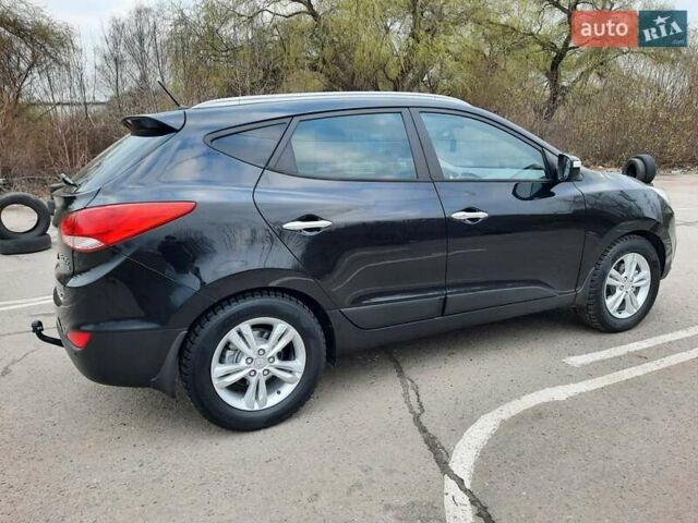 Чорний Хендай іх35, об'ємом двигуна 2 л та пробігом 211 тис. км за 12700 $, фото 18 на Automoto.ua