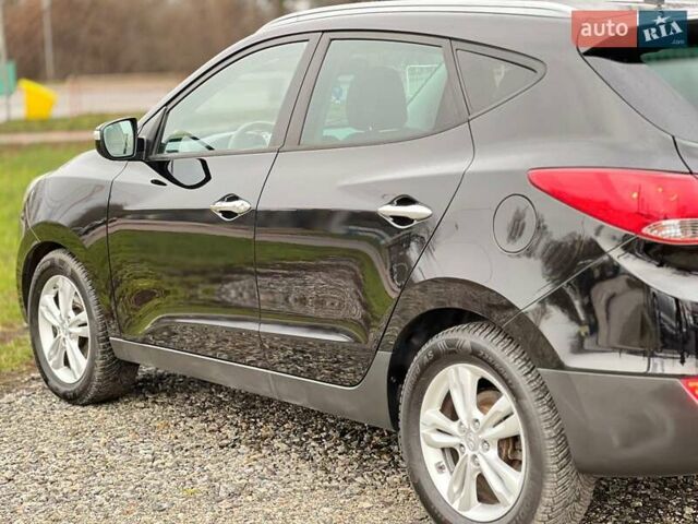 Чорний Хендай іх35, об'ємом двигуна 2 л та пробігом 195 тис. км за 12800 $, фото 19 на Automoto.ua