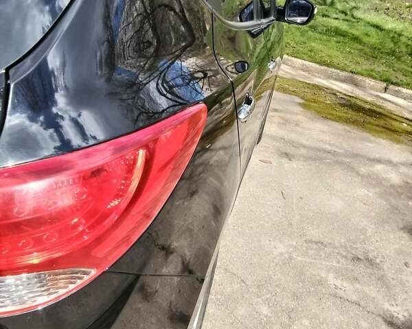 Чорний Хендай іх35, об'ємом двигуна 2 л та пробігом 180 тис. км за 12999 $, фото 12 на Automoto.ua