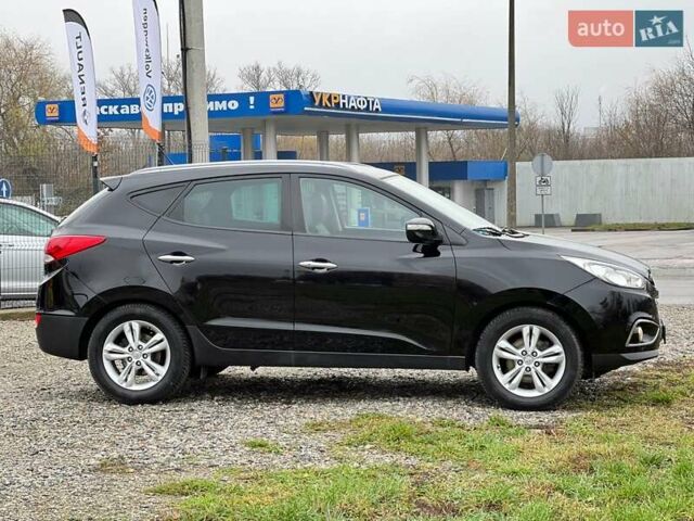 Чорний Хендай іх35, об'ємом двигуна 2 л та пробігом 195 тис. км за 12800 $, фото 24 на Automoto.ua