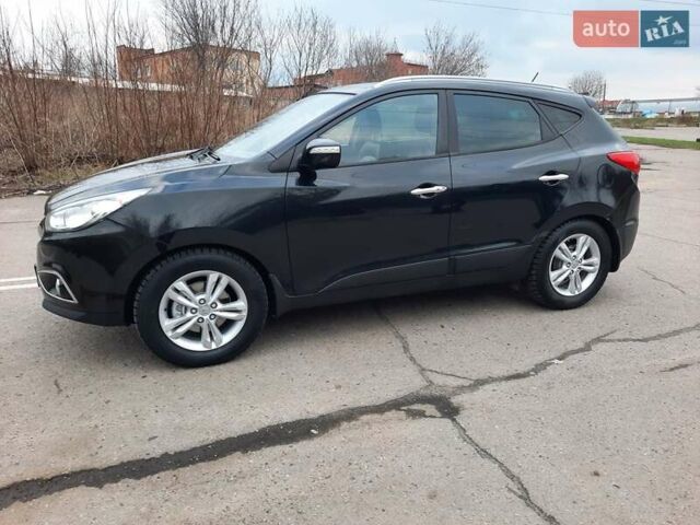 Чорний Хендай іх35, об'ємом двигуна 2 л та пробігом 211 тис. км за 12700 $, фото 9 на Automoto.ua