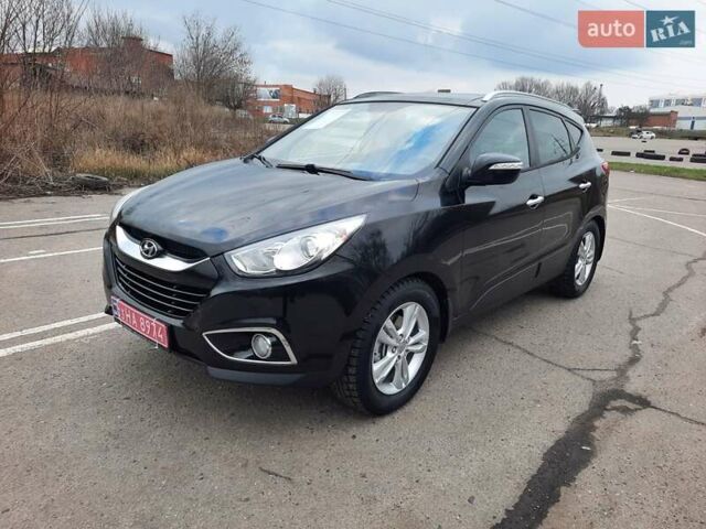 Чорний Хендай іх35, об'ємом двигуна 2 л та пробігом 211 тис. км за 12700 $, фото 7 на Automoto.ua