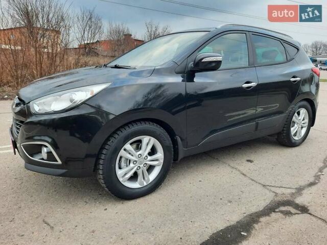 Чорний Хендай іх35, об'ємом двигуна 2 л та пробігом 211 тис. км за 12700 $, фото 121 на Automoto.ua
