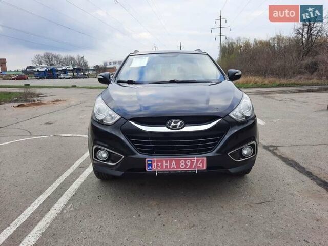 Чорний Хендай іх35, об'ємом двигуна 2 л та пробігом 211 тис. км за 12700 $, фото 4 на Automoto.ua