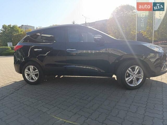 Чорний Хендай іх35, об'ємом двигуна 2 л та пробігом 237 тис. км за 12950 $, фото 1 на Automoto.ua