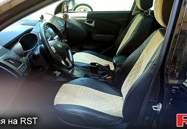 Чорний Хендай іх35, об'ємом двигуна 2 л та пробігом 167 тис. км за 13800 $, фото 7 на Automoto.ua