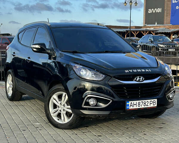 Чорний Хендай іх35, об'ємом двигуна 2 л та пробігом 241 тис. км за 14400 $, фото 1 на Automoto.ua