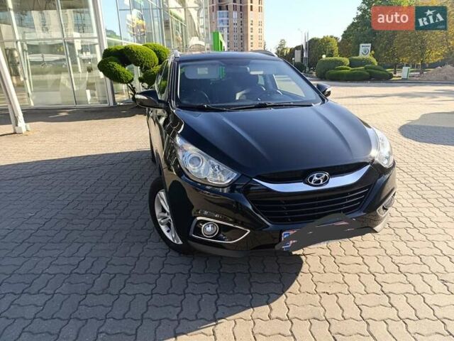 Чорний Хендай іх35, об'ємом двигуна 2 л та пробігом 237 тис. км за 12950 $, фото 19 на Automoto.ua