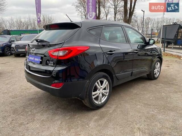 Черный Хендай их35, объемом двигателя 1.69 л и пробегом 194 тыс. км за 12500 $, фото 4 на Automoto.ua