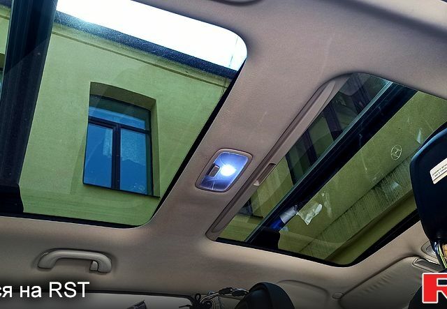 Чорний Хендай іх35, об'ємом двигуна 2 л та пробігом 167 тис. км за 13800 $, фото 4 на Automoto.ua