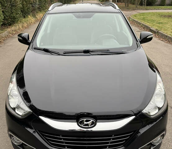 Чорний Хендай іх35, об'ємом двигуна 2 л та пробігом 177 тис. км за 14650 $, фото 4 на Automoto.ua