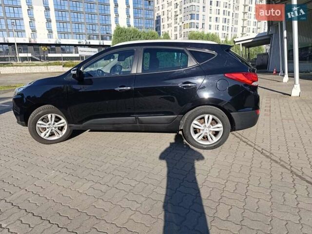 Чорний Хендай іх35, об'ємом двигуна 2 л та пробігом 237 тис. км за 12950 $, фото 3 на Automoto.ua