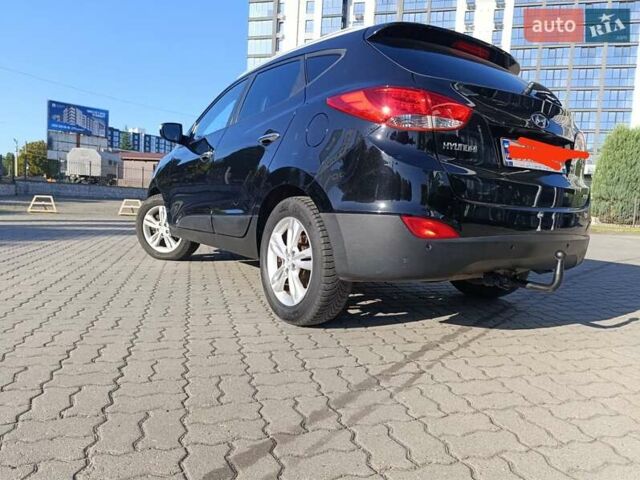 Чорний Хендай іх35, об'ємом двигуна 2 л та пробігом 237 тис. км за 12950 $, фото 21 на Automoto.ua