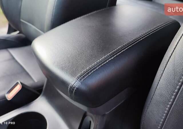 Чорний Хендай іх35, об'ємом двигуна 2 л та пробігом 203 тис. км за 13750 $, фото 1 на Automoto.ua