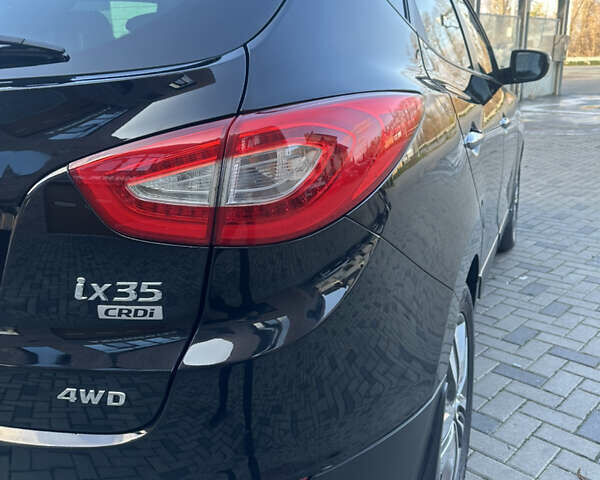 Чорний Хендай іх35, об'ємом двигуна 2 л та пробігом 230 тис. км за 13400 $, фото 9 на Automoto.ua