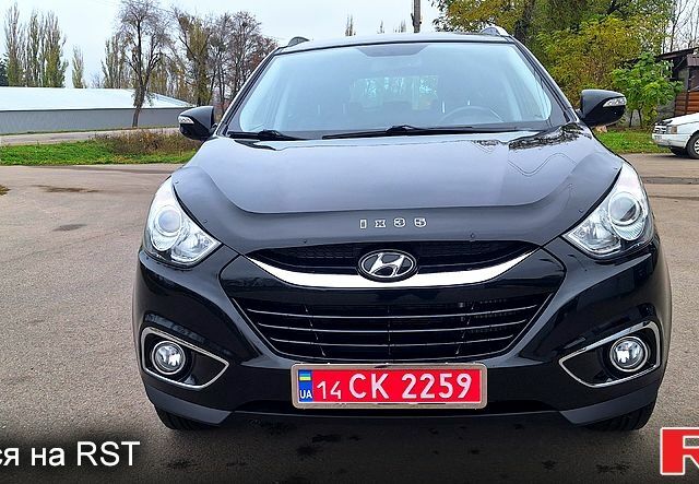 Чорний Хендай іх35, об'ємом двигуна 2 л та пробігом 169 тис. км за 14300 $, фото 1 на Automoto.ua