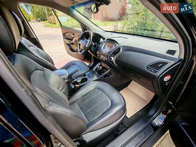 Чорний Хендай іх35, об'ємом двигуна 2 л та пробігом 193 тис. км за 14250 $, фото 18 на Automoto.ua