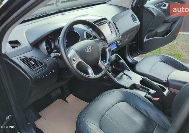 Чорний Хендай іх35, об'ємом двигуна 2 л та пробігом 203 тис. км за 13750 $, фото 13 на Automoto.ua