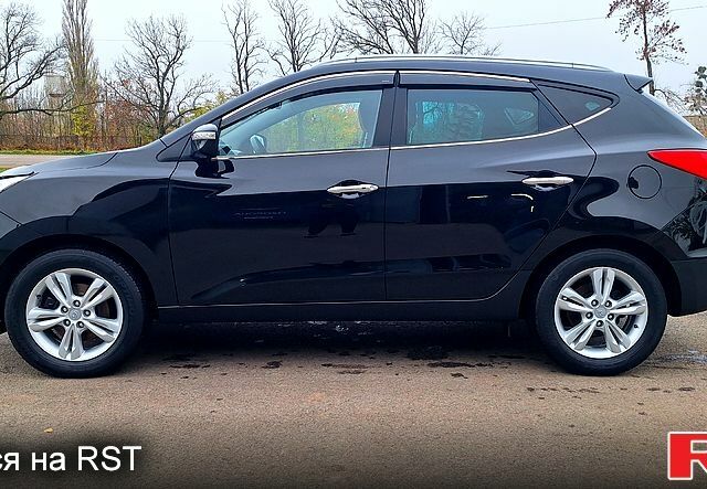 Чорний Хендай іх35, об'ємом двигуна 2 л та пробігом 169 тис. км за 14300 $, фото 3 на Automoto.ua