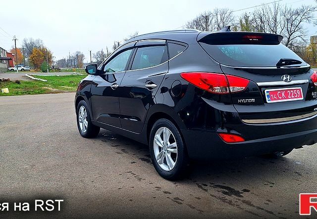 Чорний Хендай іх35, об'ємом двигуна 2 л та пробігом 169 тис. км за 14300 $, фото 6 на Automoto.ua