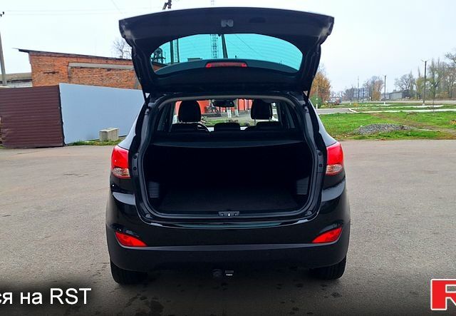 Чорний Хендай іх35, об'ємом двигуна 2 л та пробігом 169 тис. км за 14300 $, фото 11 на Automoto.ua