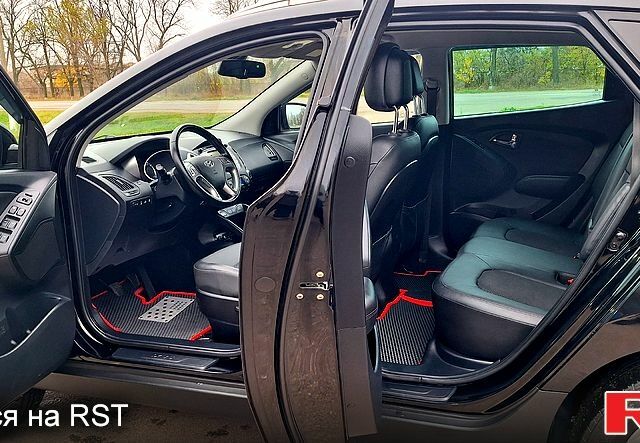 Чорний Хендай іх35, об'ємом двигуна 2 л та пробігом 169 тис. км за 14300 $, фото 8 на Automoto.ua