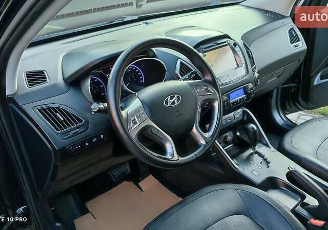 Чорний Хендай іх35, об'ємом двигуна 2 л та пробігом 203 тис. км за 13750 $, фото 2 на Automoto.ua