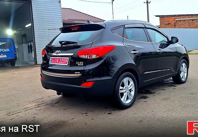 Чорний Хендай іх35, об'ємом двигуна 2 л та пробігом 169 тис. км за 14300 $, фото 5 на Automoto.ua
