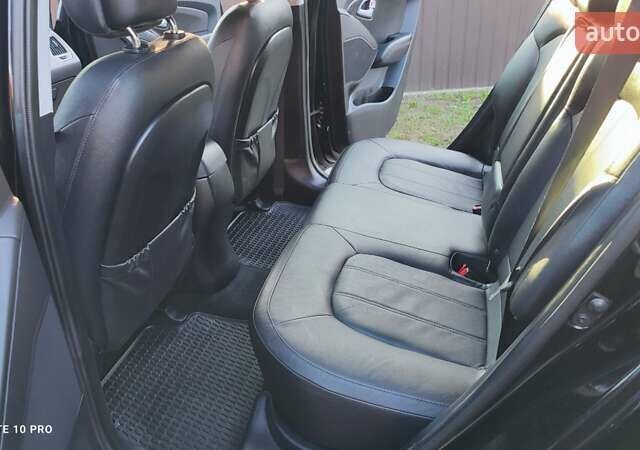 Чорний Хендай іх35, об'ємом двигуна 2 л та пробігом 203 тис. км за 13750 $, фото 3 на Automoto.ua