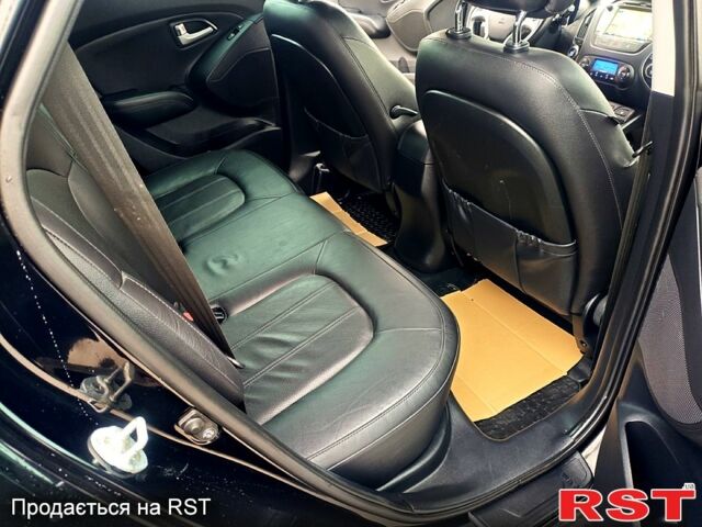 Чорний Хендай іх35, об'ємом двигуна 2 л та пробігом 203 тис. км за 13500 $, фото 2 на Automoto.ua